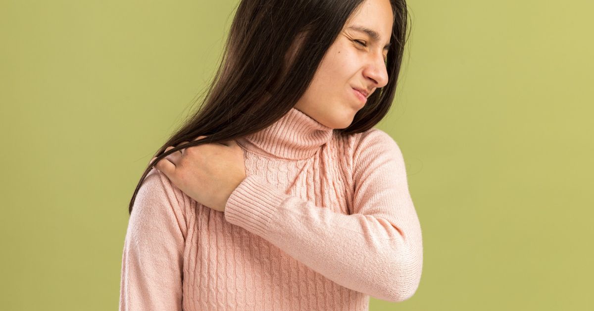 Adult with shoulder stiffness limiting arm movement consulting an orthopedic surgeon in Indore for evaluation and treatment